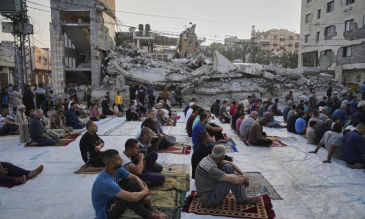 Gaza marks start of Eid with outdoor prayers amongst rubble with food growing ever scarcer Gaza marks start of Eid with outdoor prayers amongst rubble with food growing ever scarcer