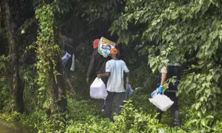 SIT revisits forest near Dharmasthala with complainant in alleged mass burial probe SIT revisits forest near Dharmasthala with complainant in alleged mass burial probe