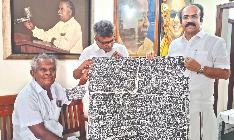 Pudukkottai  epigraphist hands inscription copies to Thennarasu for preserving